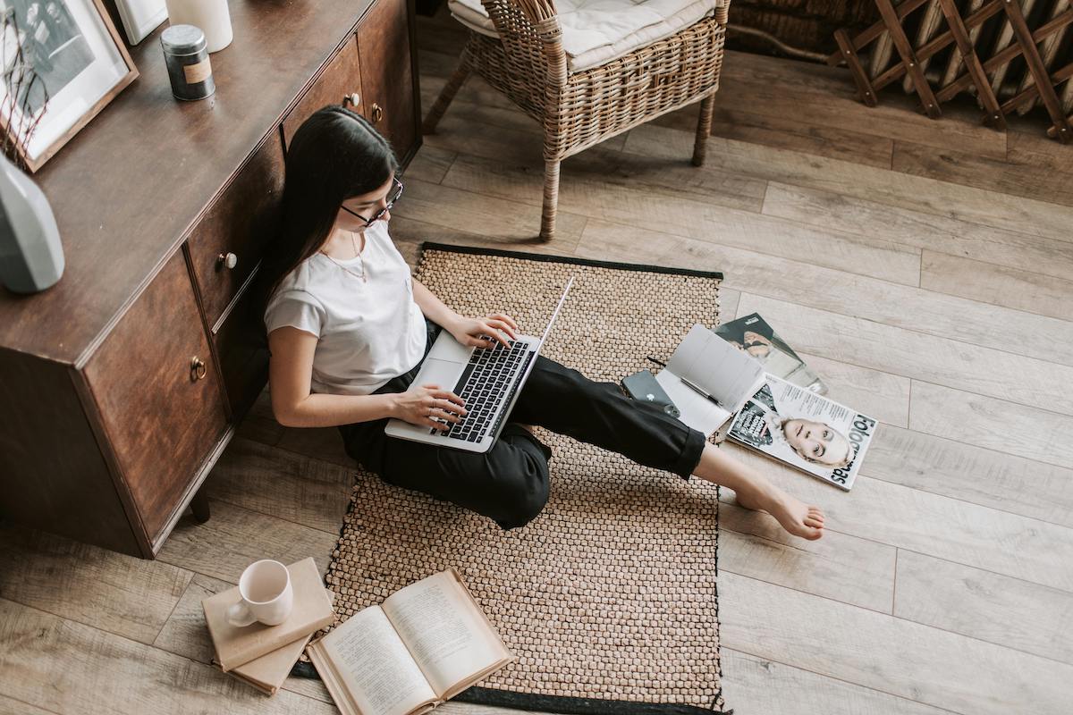 A hand holding a printed one-page strategic playbook in a warm, softly lit office, with a pen and a cup of coffee nearby, symbolizing the final ritual of distilling complex strategy into a clear, actionable single page.